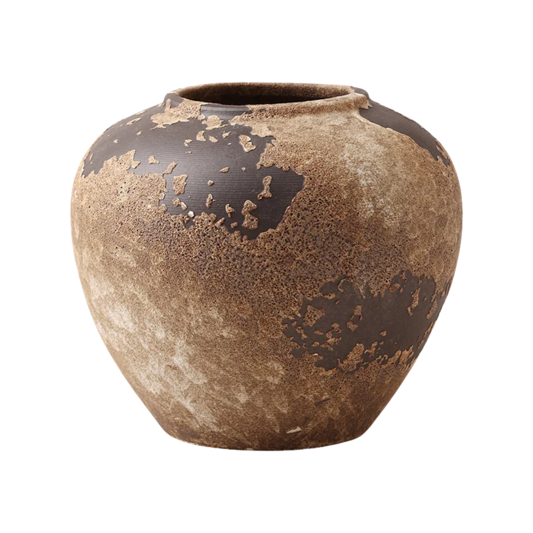 Rustic ceramic vase with textured brown and earthy tones on a black background